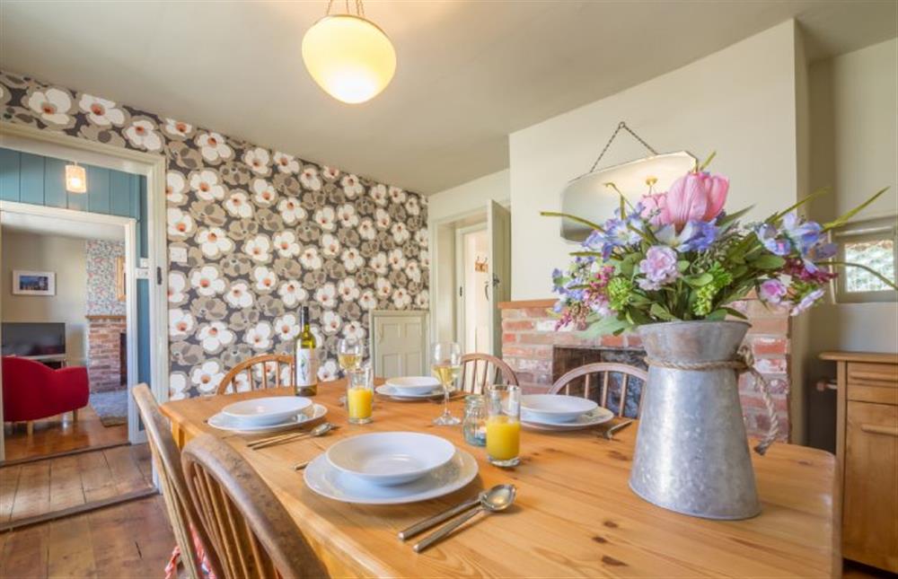 Ground floor: Dining room with door through to sitting room at Mulberry Cottage, Wells-next-the-Sea