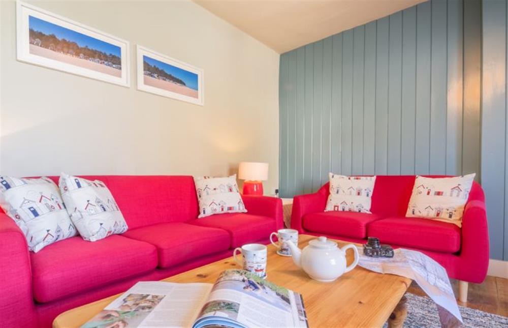 Ground floor: Sitting room with comfy sofas at Mulberry Cottage, Wells-next-the-Sea