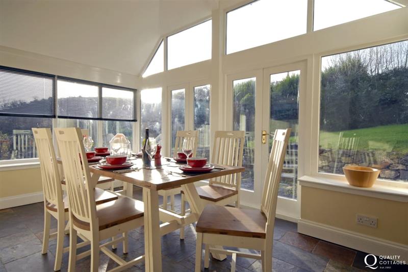 Dining room with garden views at Mullock Bridge, Dale