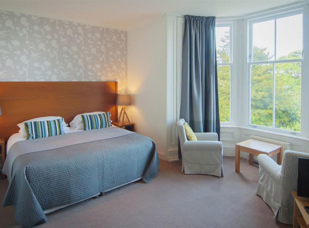 Bedroom with super king size zip and link twin beds at Munros in Rothesay, Isle of Bute, Argyll and Bute, Scotland