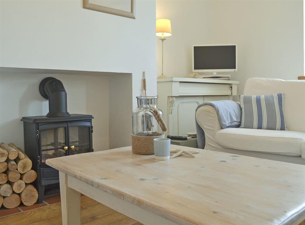 Relax and unwind in this comfortable living area at Mur Llwyd in Rhoshirwaun, near Pwllheli, Gwynedd