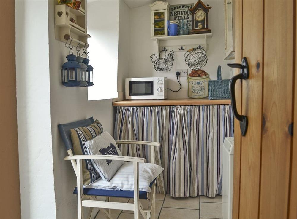 Utility room hosting freezer and washing machine at Mur Llwyd in Rhoshirwaun, near Pwllheli, Gwynedd