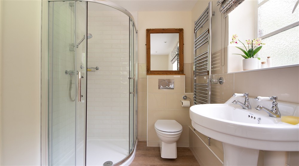The freestanding shower at Mustard Pot Cottage in Norwich, Norfolk