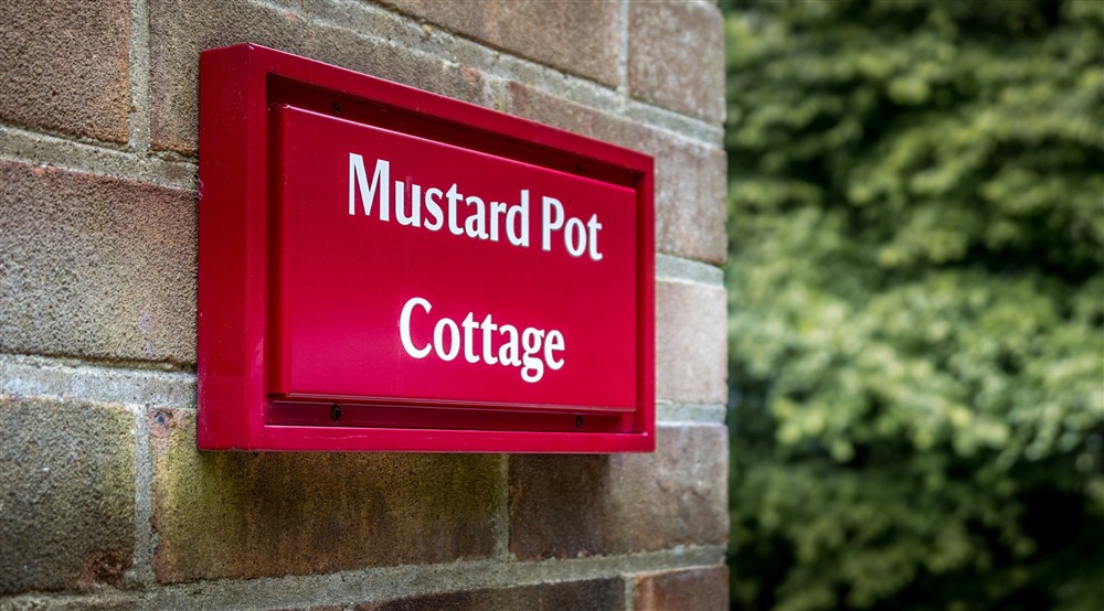 The sign for Mustard Pot Cottage, Norfolk at Mustard Pot Cottage in Norwich, Norfolk