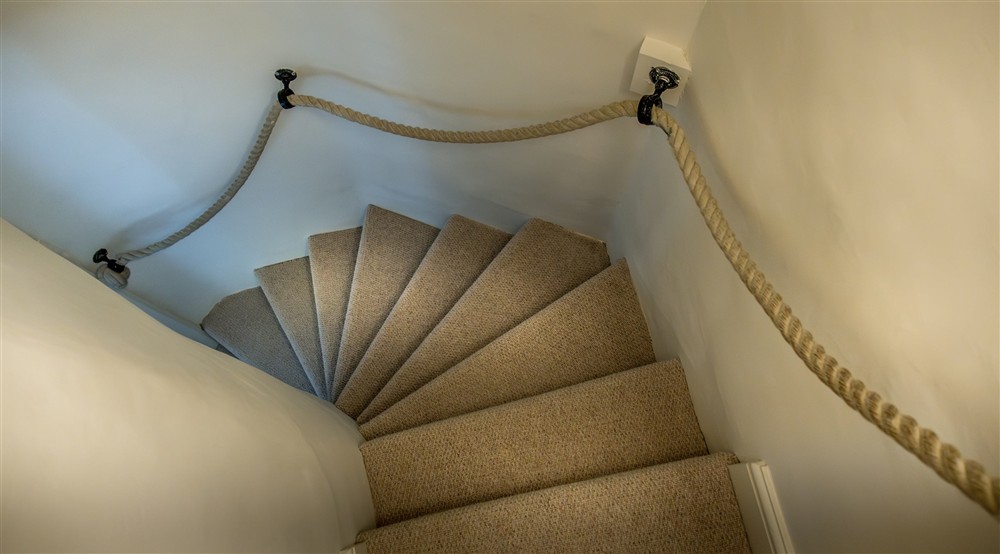 The staircase up to the reading room on the first floor of Mustard Pot Cottage, Norfolk at Mustard Pot Cottage in Norwich, Norfolk