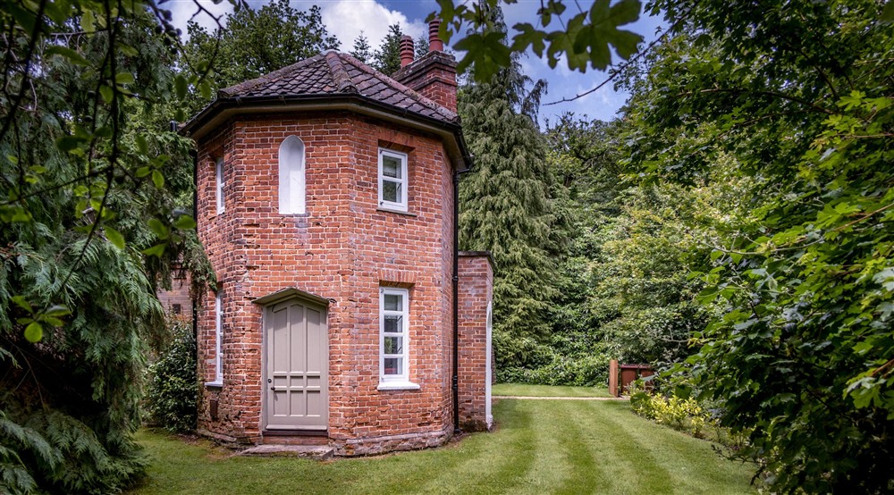 The two-storey octagonal tower for which Mustard Pot Cottage is named, surrounded by grass and trees, Norfolk (photo 2) at Mustard Pot Cottage in Norwich, Norfolk