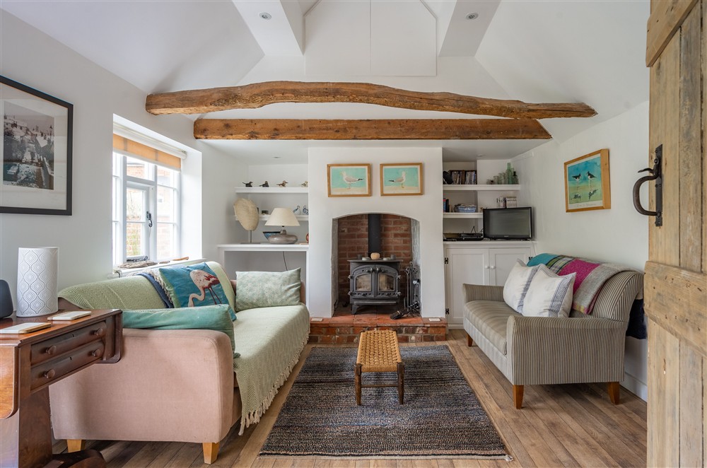 Exposed beams, unique artwork and curio make this cottage truly unique at Myrtle Cottage, Friston