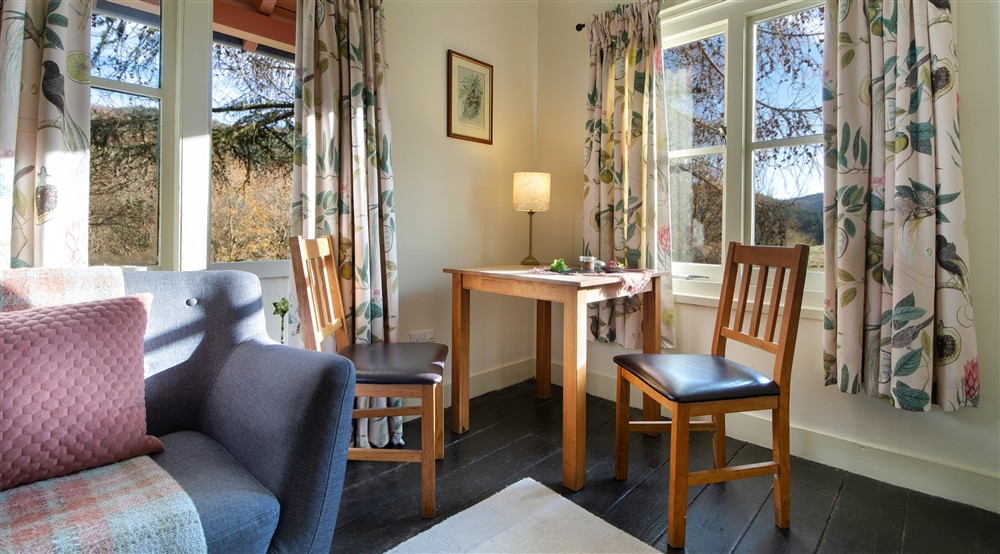 The table for two in the sitting room at Nant Las in Dolgellau, Gwynedd