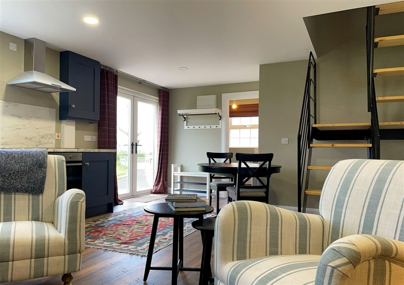 Relax in the living area (photo 2) at Narrow Gauge Cottage, Armoy