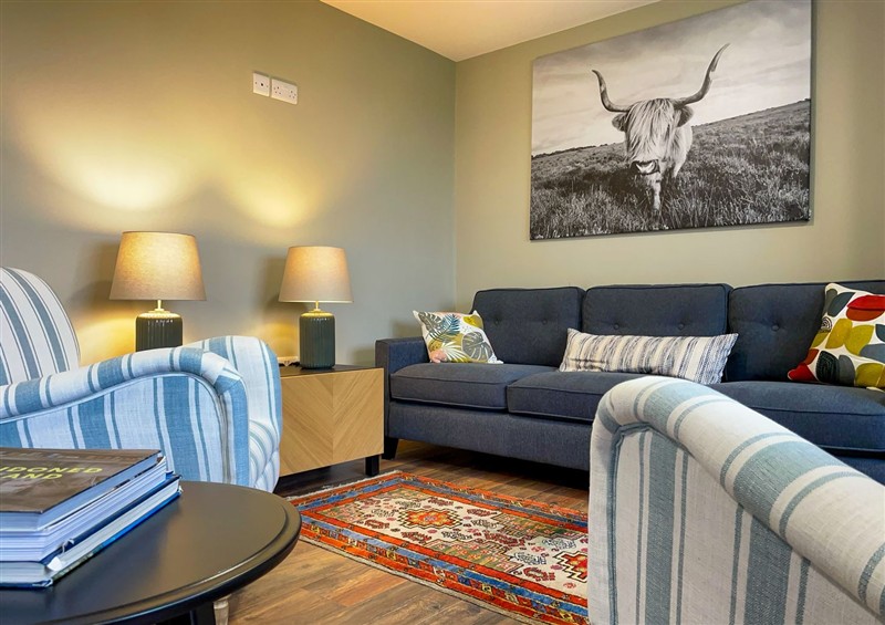 Relax in the living area at Narrow Gauge Cottage, Armoy