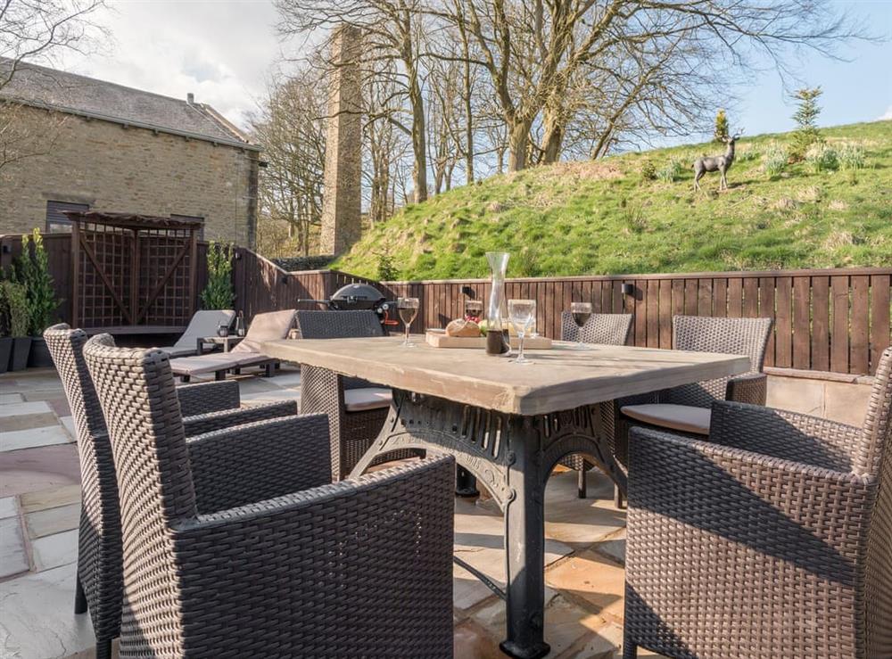 Spacious patio with ample outdoor furniture at Narrowgates Cottage in Barley, near Barrowford, Lancashire, England