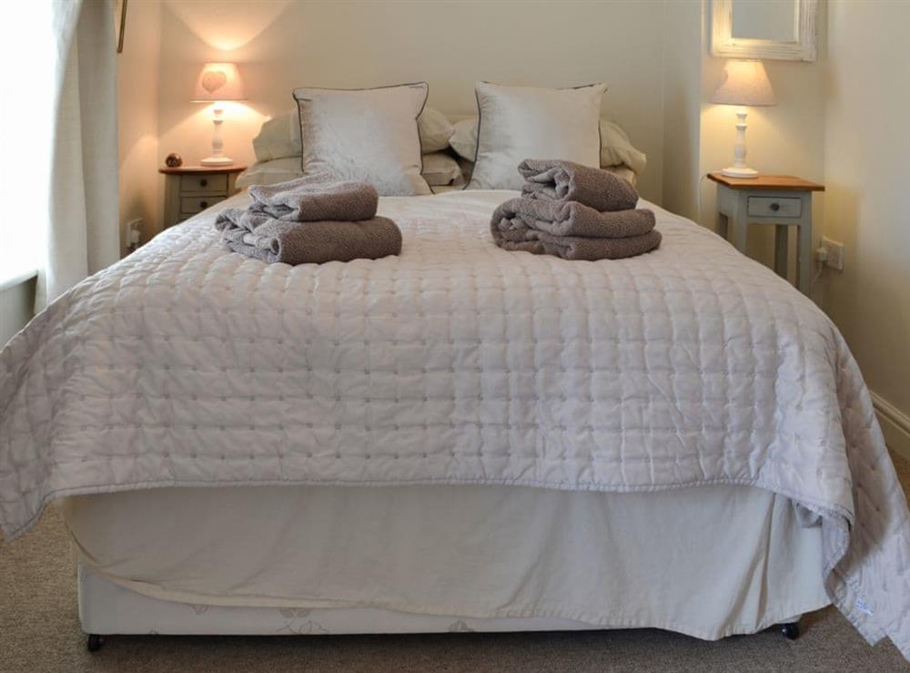 Romantic and inviting double bedroom at Bluebell Cottage, 