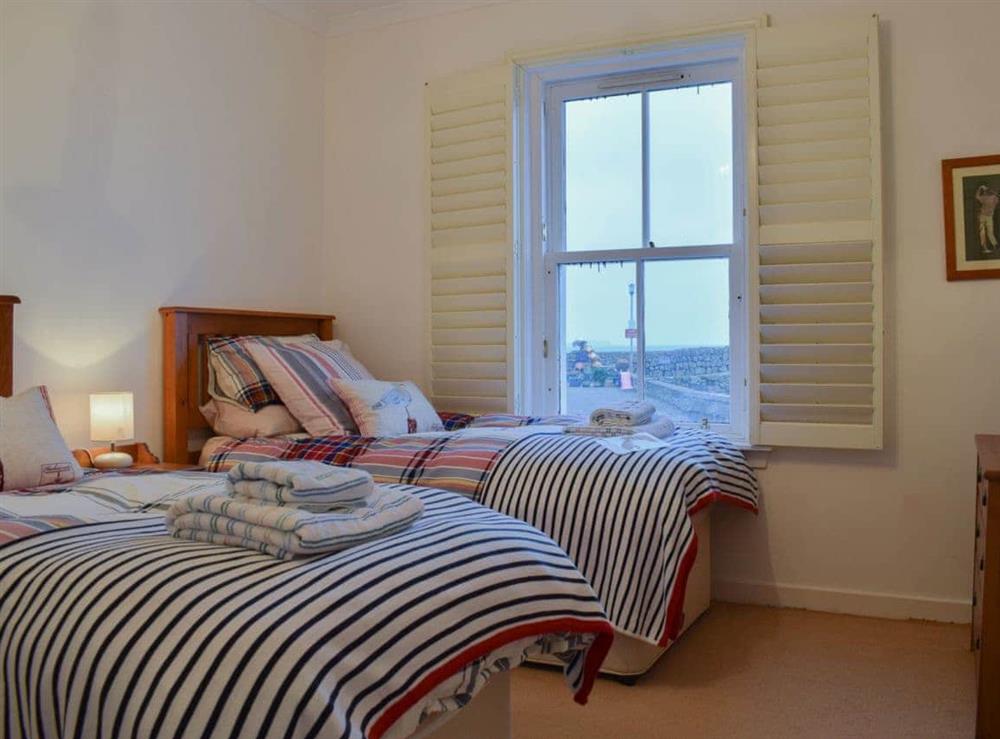 Twin bedroom with sea and harbour views at Nautilus Cottage in Cellardyke, near Anstruther, Fife
