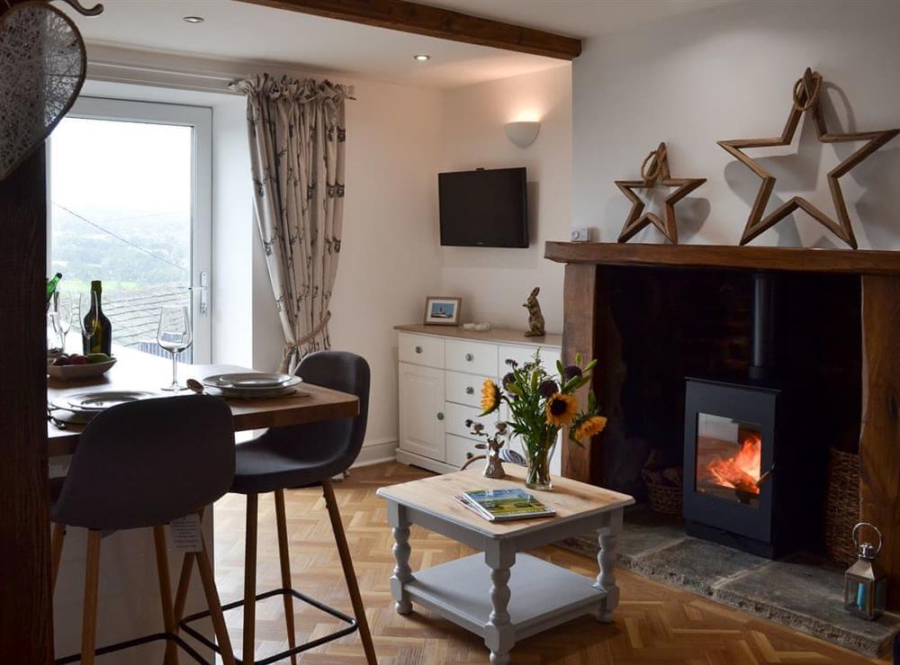 Open plan living space with wood burner at Near Bank View Cottage in Shelley, near Huddersfield, West Yorkshire