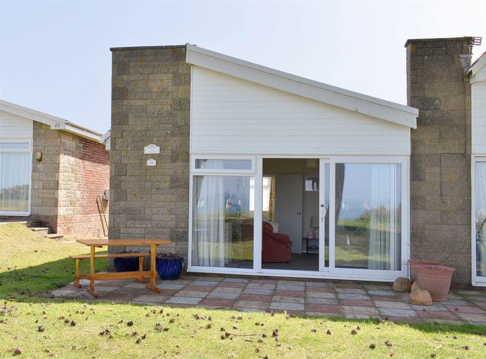 Charming holiday home with patio area at Needles and Winds in Freshwater, Isle of Wight