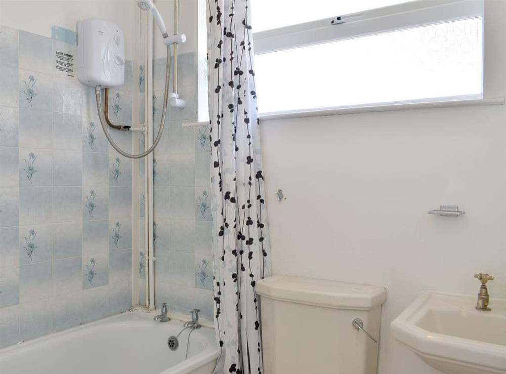Family bathroom with shower over bath at Needles and Winds in Freshwater, Isle of Wight