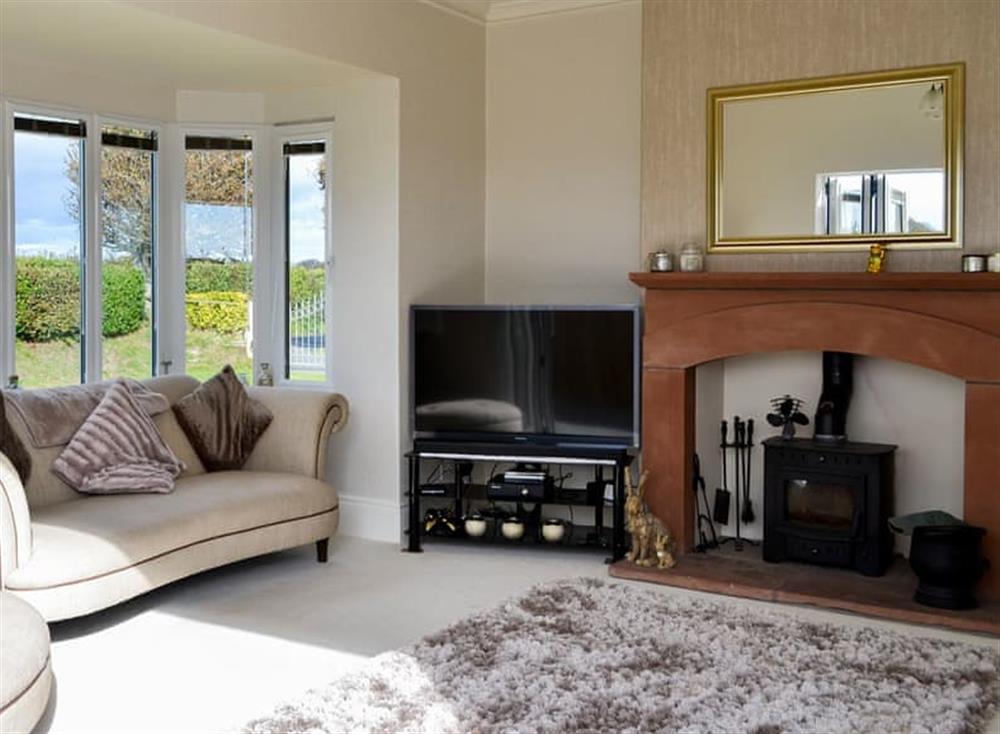 Cosy living room with wood burner at Neeprig in Skinburness, near Silloth, Cumbria