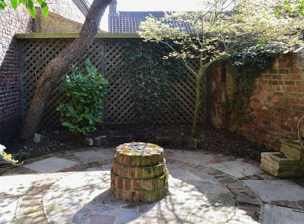 Lovely courtyard-style garden at Nells Cottage in Bridlington, North Humberside
