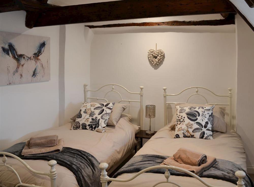 Quaint twin bedded room at Nells Cottage in Bridlington, North Humberside