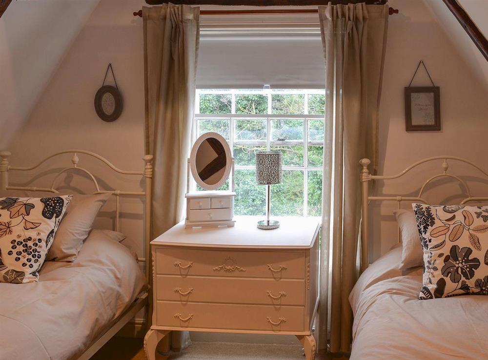 Twin bedroom with beamed ceiling at Nells Cottage in Bridlington, North Humberside
