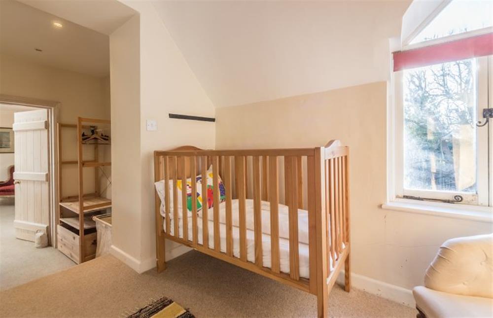 First floor: Nursery room off the master bedroom has single bed and cot (photo 2) at Nelsons Barn, Burnham Thorpe near Kings Lynn