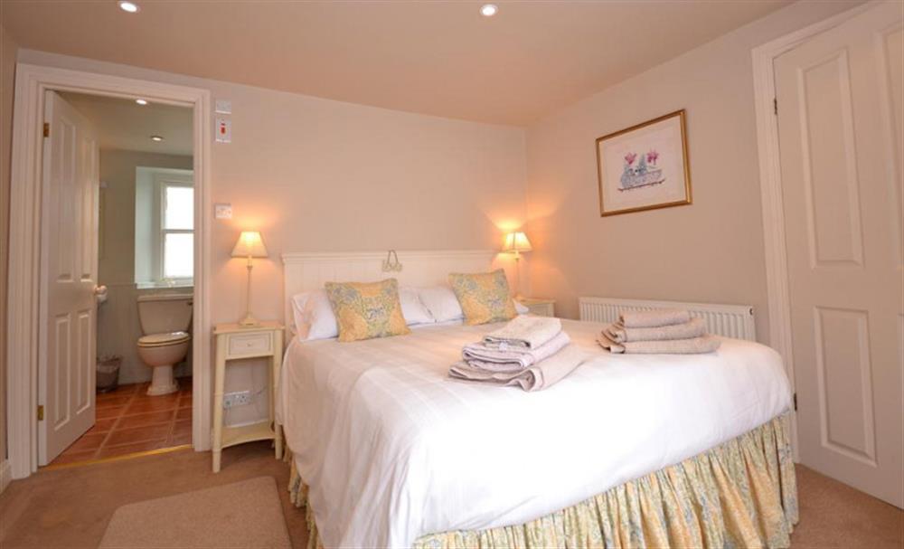 Another view of the master bedroom, showing the door into the en-suite at Nelsons Cottage in Looe