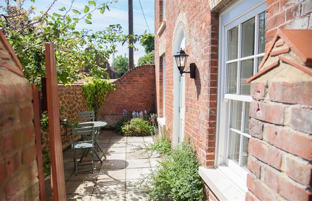 Front garden has seating area at Neptune Cottage, Old Hunstanton