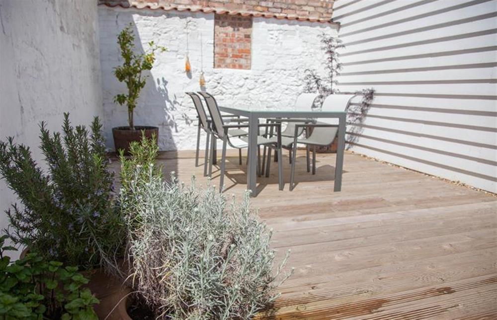 Private rear decked walled garden at Neptune Cottage, Old Hunstanton