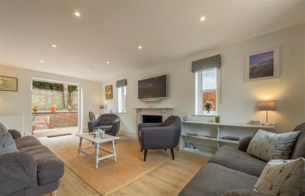 Ground floor: Sitting room with access to patio and garden  at Neptune House, Wells-next-the-Sea