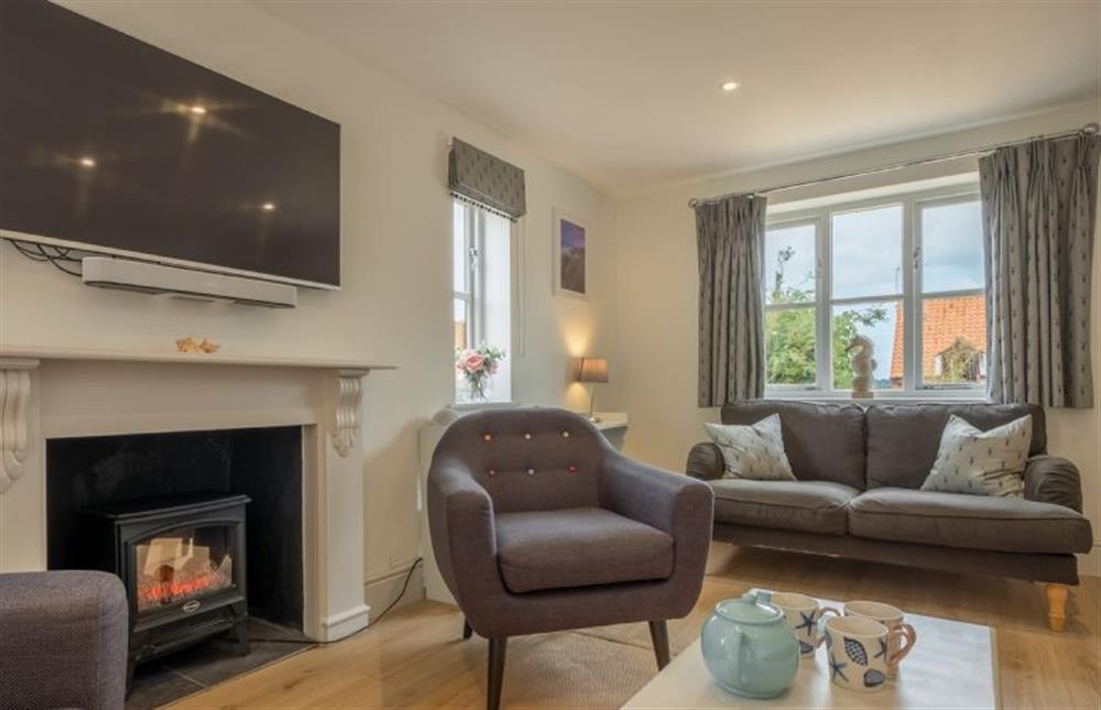 Ground floor: Sitting room with electric fire at Neptune House, Wells-next-the-Sea