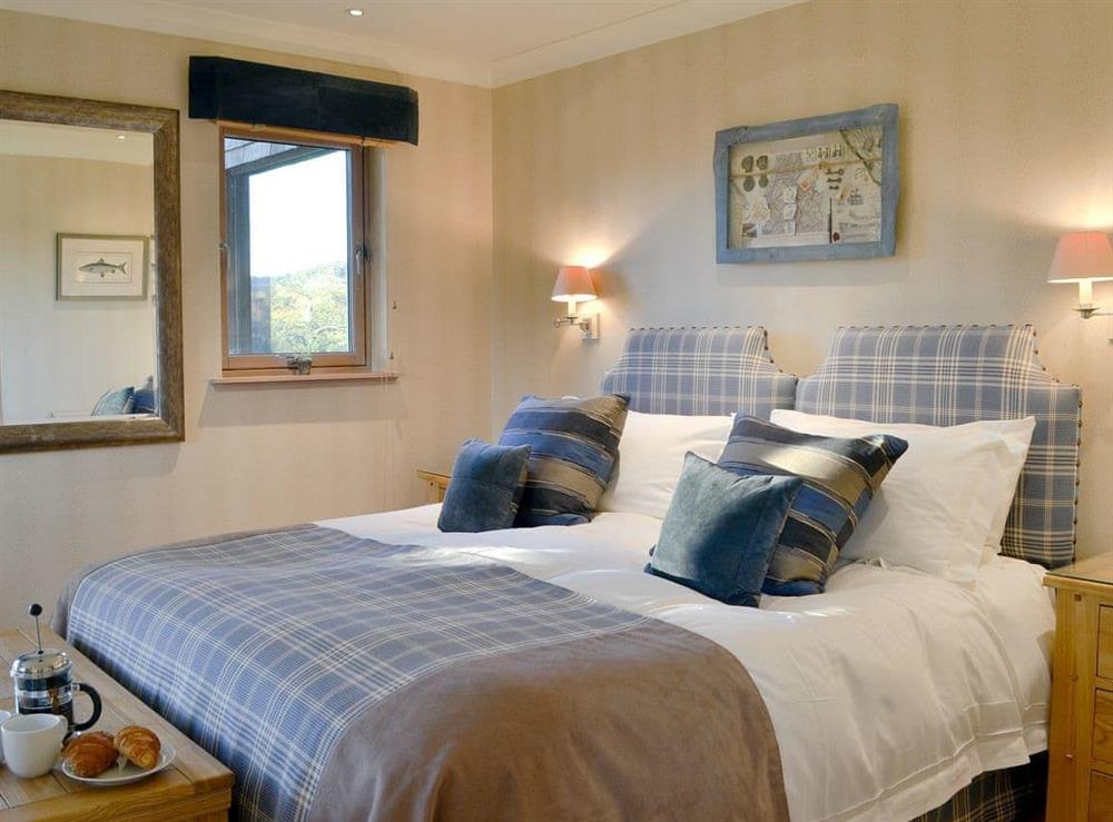 Stylish double bedroom at River Lodge, 
