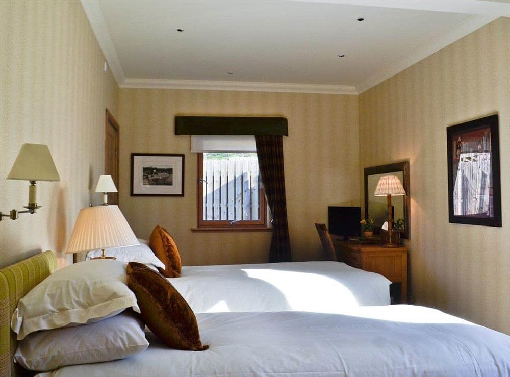 Tastefully furnished twin bedroom at River Lodge, 