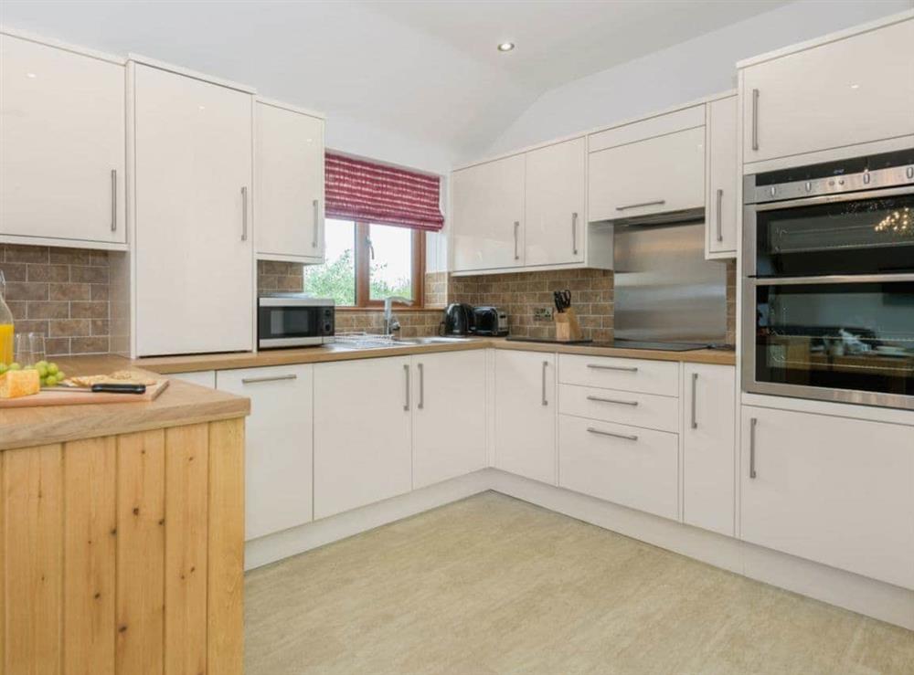 Contemporary kitchen area at Nesting Box in Chapel-St-Leonards, Lincolnshire