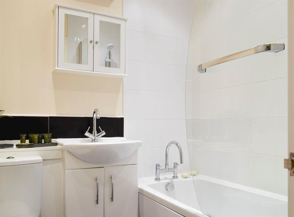 Bathroom with shower over bath at Kinneddar Cottage, 