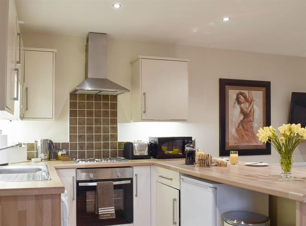 Well-equipped fitted kitchen at Kinneddar Cottage, 