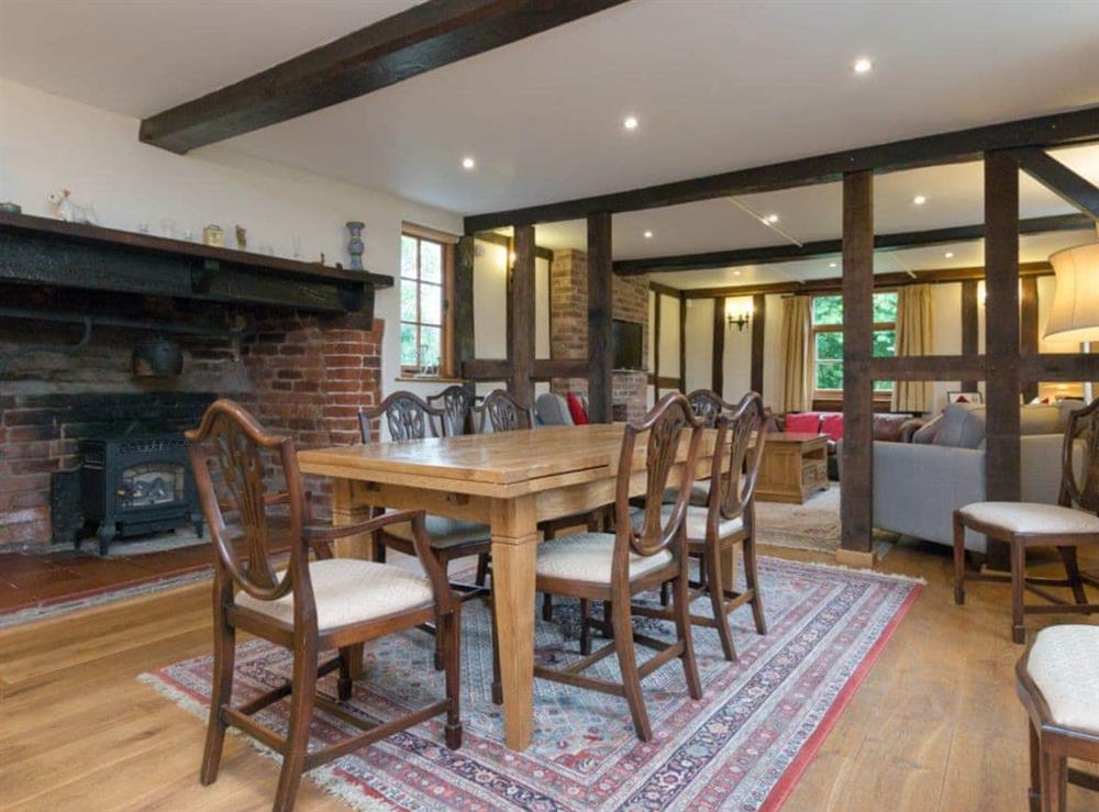 Large dining room with feature fireplace at Brook House, 