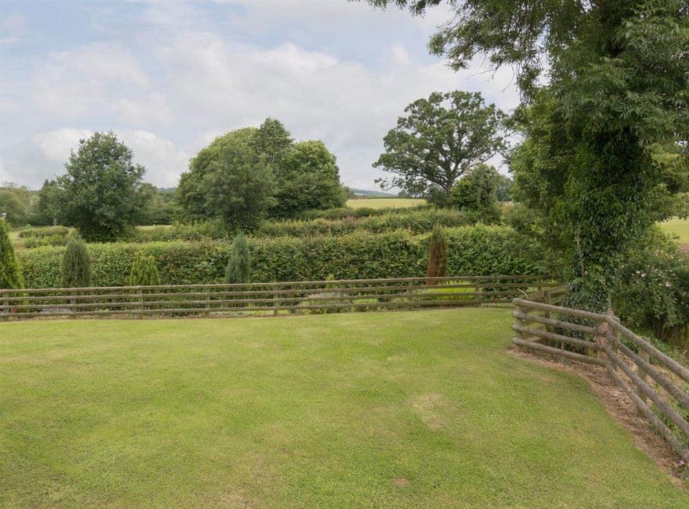 Lawned garden in peaceful rural surroundings at Parkers Lodge, 