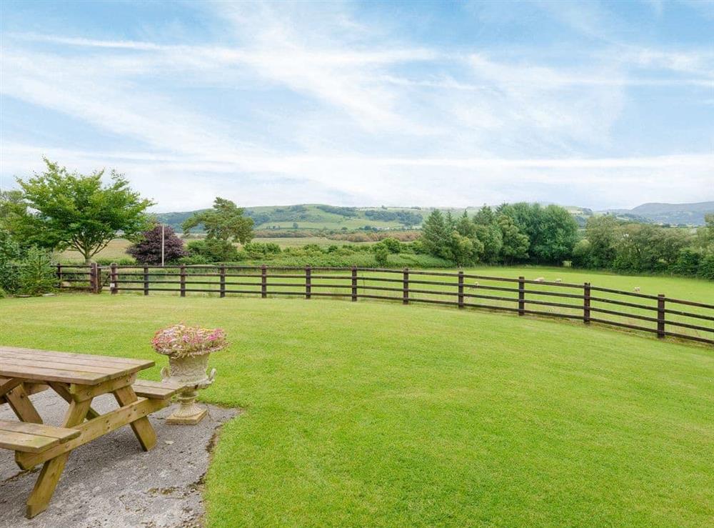 Large lawned garden with wonderful countryside views at Neuaddlas Country House in Tregaron, near Aberystwyth, Dyfed