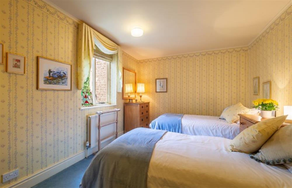 First floor: Bedroom three has twin beds and a window and is served by a small en-suite shower room at New Chambers, Old Hunstanton