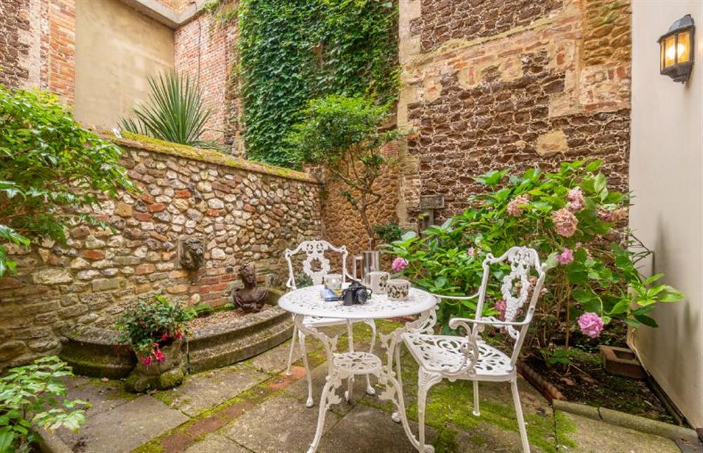 Ground floor:  The inner courtyard is fully-enclosed and has a bistro table and chairs at New Chambers, Old Hunstanton