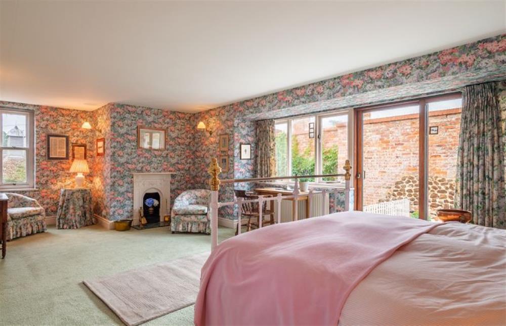 Second floor:  Master bedroom is decorated in co-ordinated prints and has plenty of storage at New Chambers, Old Hunstanton