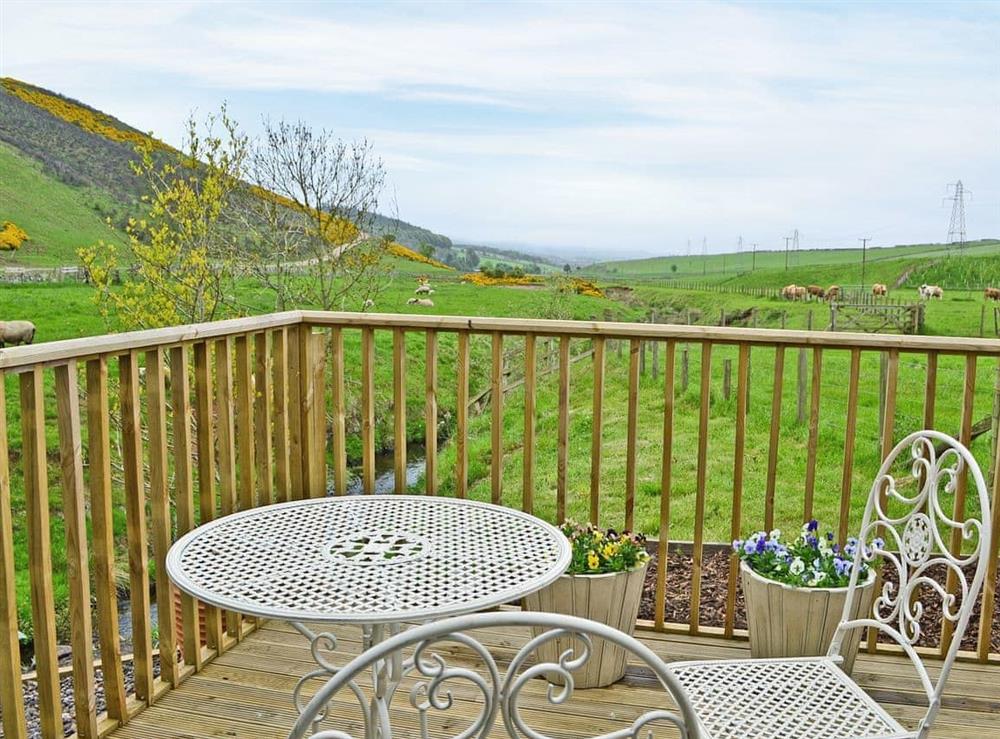 Inviting decked patio with amazing views at Bridge Cottage, 