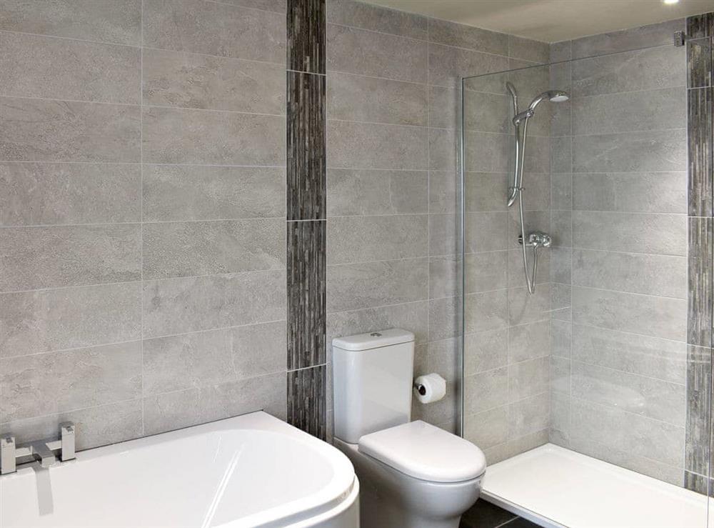 Family bathroom with bath and separate shower cubicle at New House (Visit Britain Gold Award) (Deluxe) in Windermere, Cumbria