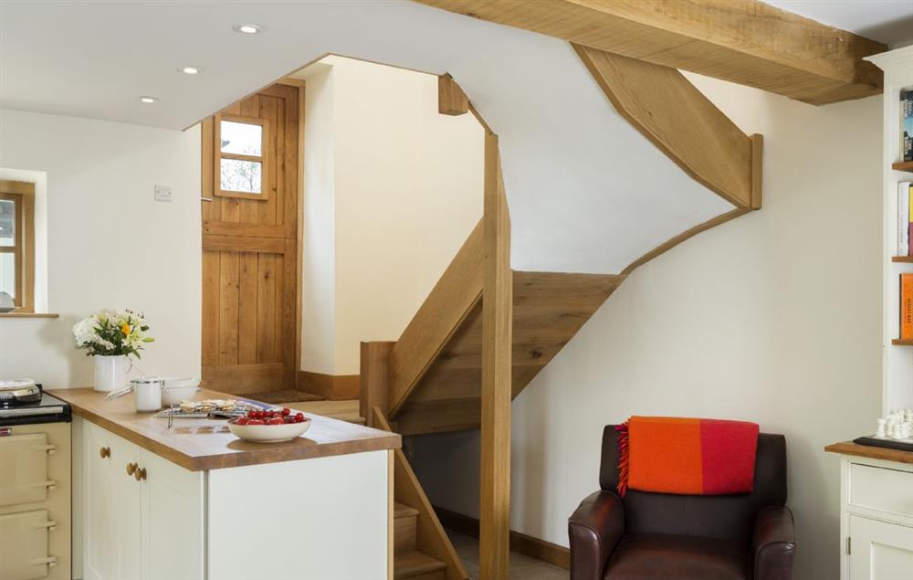 A few steps up to the stable door to garden and upwards to the galleried bedroom suite at New Inn Cottage, Cardington