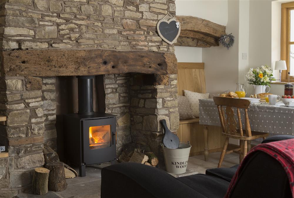 New Inn Cottage with cosy inglenook fireplace and wood burning stove at New Inn Cottage, Cardington
