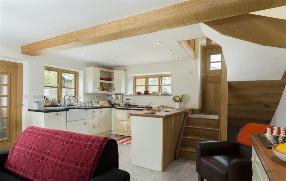 Open-plan living area with kitchen, sitting and dining area at New Inn Cottage, Cardington