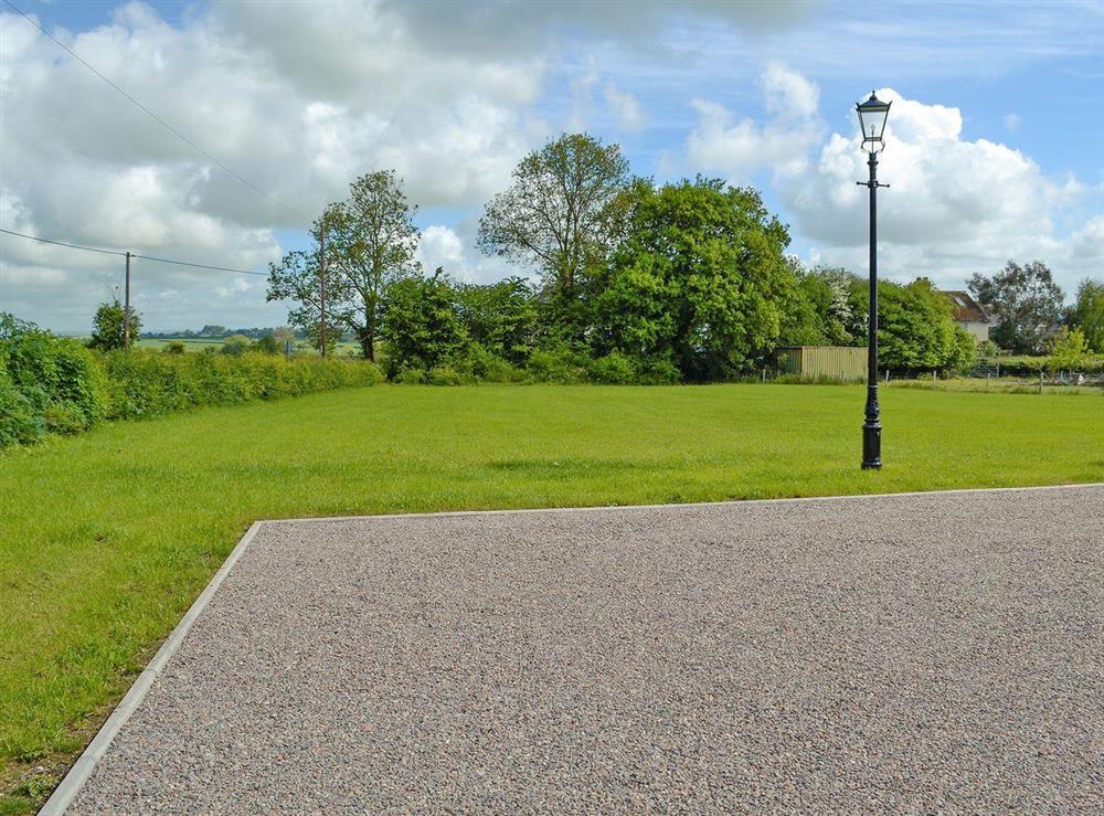 Large meadow to front. Lawned garden to rear with patio, garden furniture and BBQ at New Inn Farmhouse in Marnhull, near Shaftesbury, Dorset