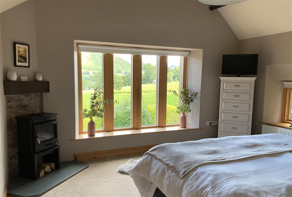 Double bedroom with 6’ zip and link bed overlooking Lake Ullswater at New Lodge, Watermillock