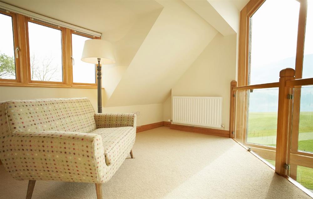 Mezzanine seating area off the master bedroom with views towards Lake Ullswater at New Lodge, Watermillock