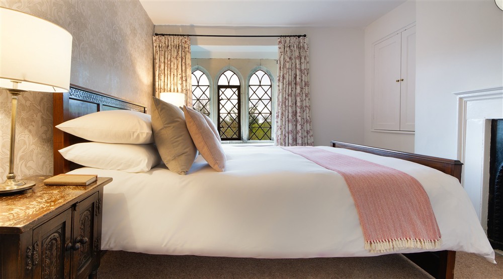 One of the king-size bedrooms at Newark Lower Lodge in Wotton-under-edge, Gloucestershire